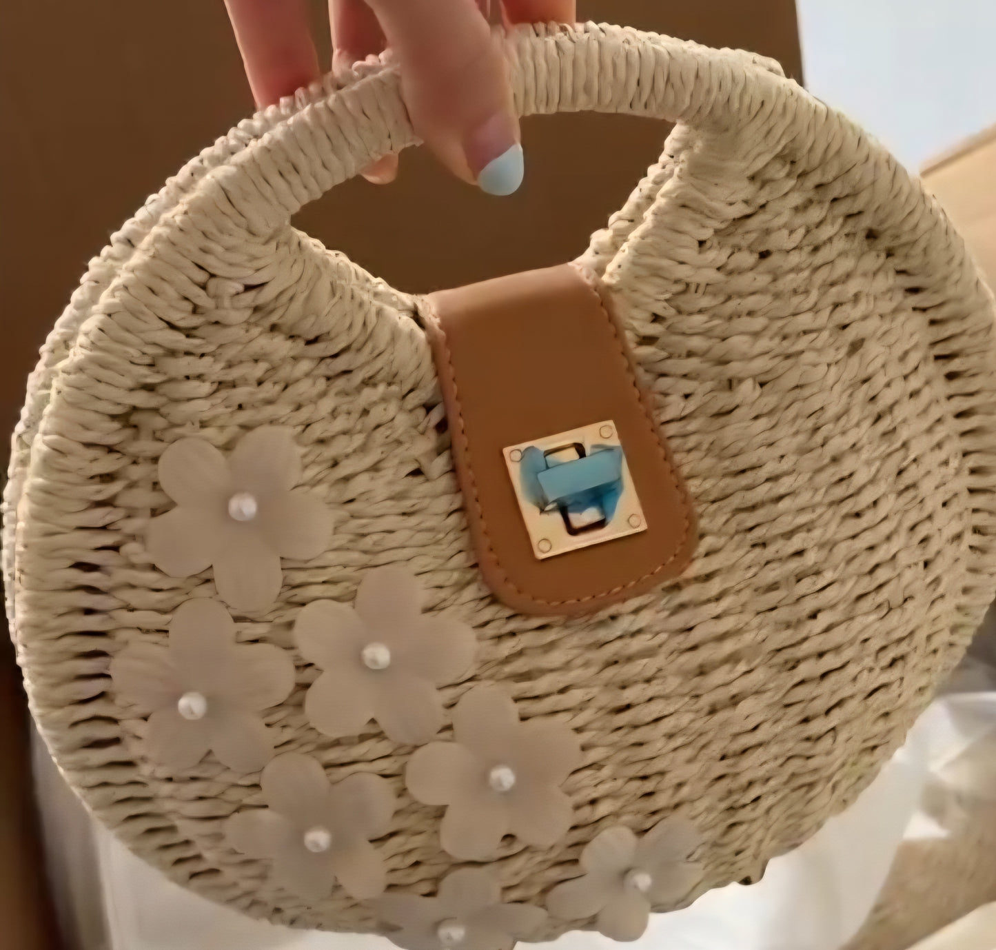Charming handcrafted beige round strawbag